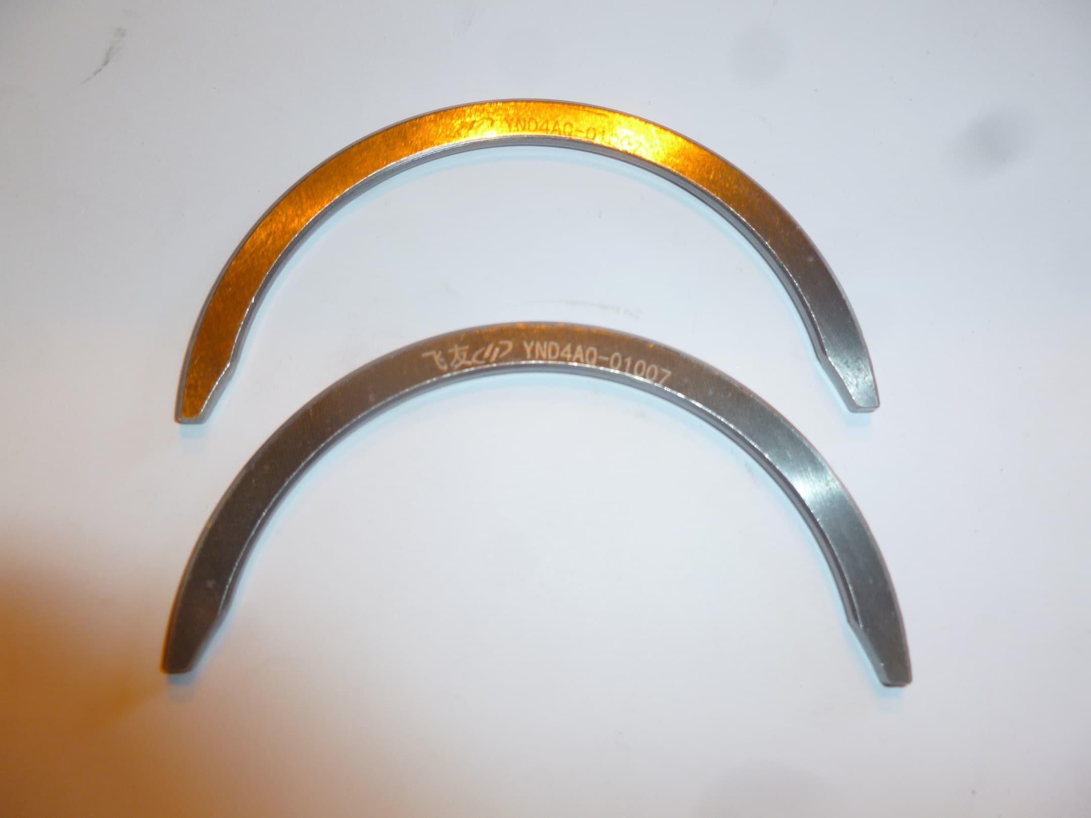 Полукольцо упорного подшипника коленчатого вала верхнее TDY 15 4L/Upper thrust piece of crancshaft